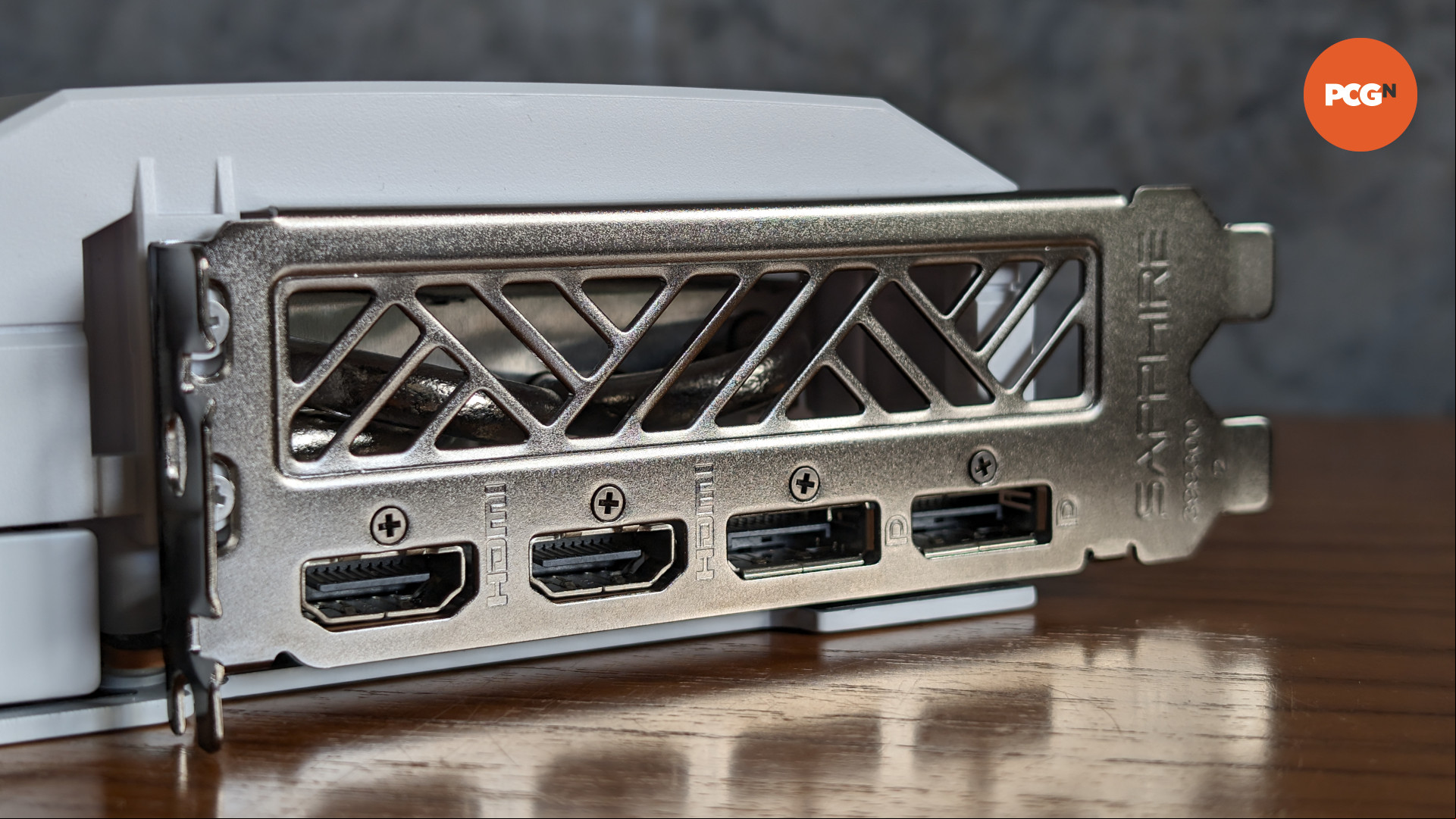 AMD Radeon RX 7900 GRE Sapphire Pure review: I/O bracket showing HDMI ports and DisplayPort outputs