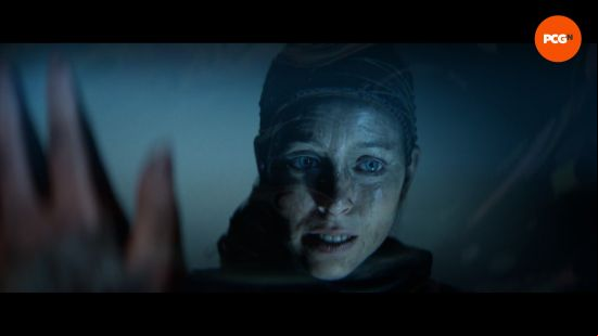Hellblade 2 review: Senua looks at her reflection in a puddle