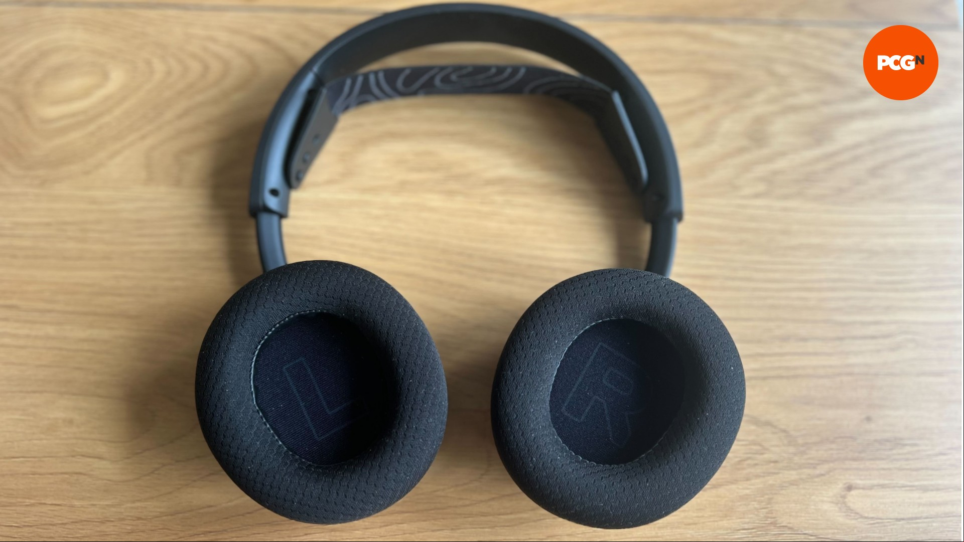 Steelseries Nova 5 wireless flat on a table showing the insides of the earcups