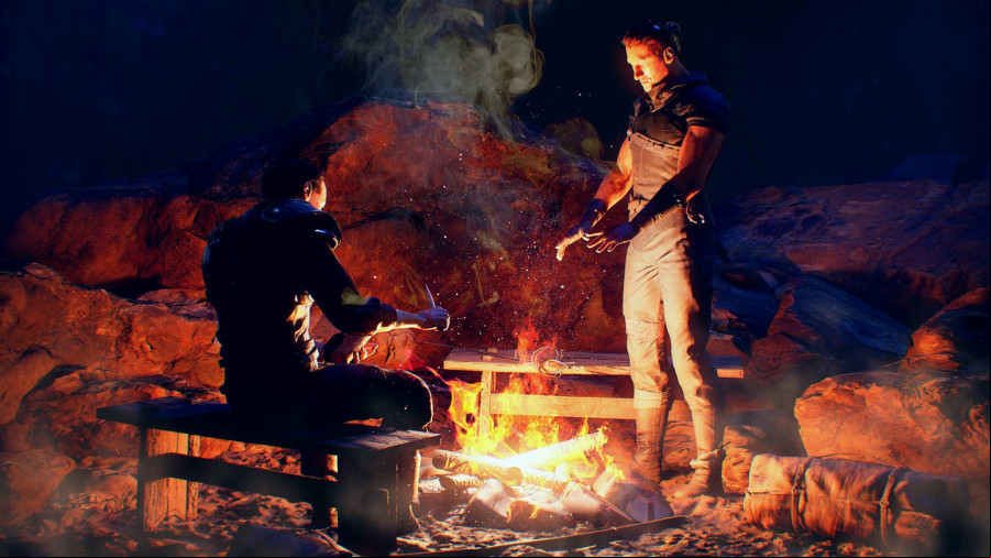 Gothic remake: two figures around a campfire, one sat on a bench, the other stood with palms outstretched