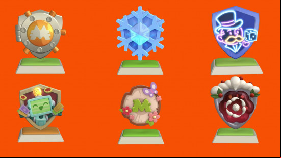 Some of the Monopoly Go shields including the snowflake, christmas, flowers, and robot