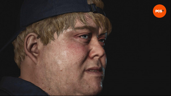The rotund face of Eddie, played by Scott Haining and Danny Kirrane in the Silent Hill 2 remake cast list, wearing a backwards cap.
