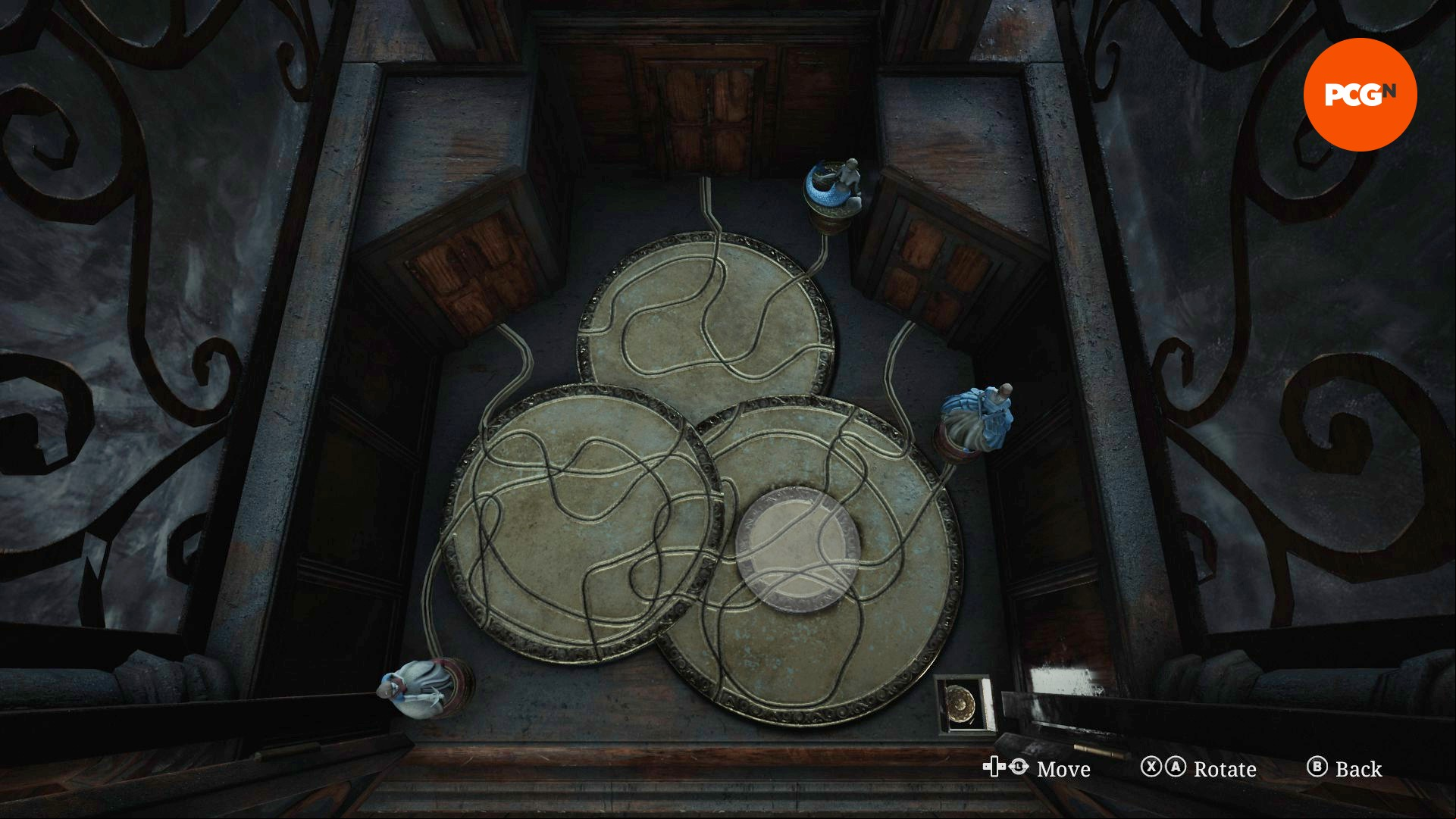 Four differently sized discs next to figurines of Snow White, Cinderellla, and The Little Mermaid in the Silent Hill 2 music box puzzle.
