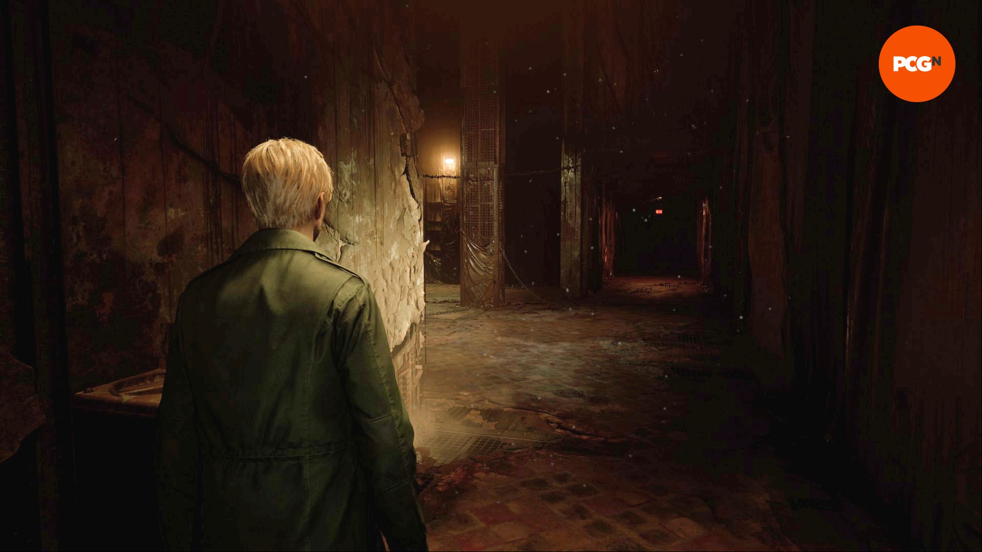 Silent Hill 2 remake review: James Sunderland walks down a gloomy corridor in the Silent Hill 2 remake.
