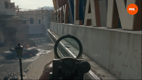 One of the Aetherella statues, lying on the Liberty Lanes sign in the Liberty Falls Black Ops 6 Zombies map.