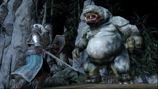Fighting an ogre in Dark Souls 2.