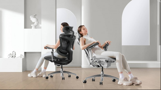 A woman wearing white sports gear reclines on a white chair, then on a black chair