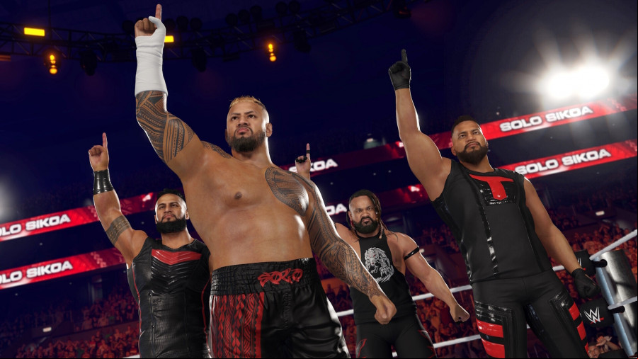 WWE 2K25: Four wrestlers with one hand raised to the sky in the corner of a ring