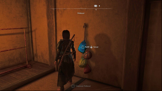 AC Shadows scouts: a female assassin stands in a dimly lit room.