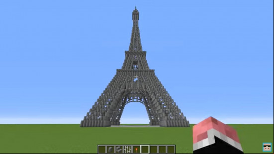 A Minecraft Eiffel Tower built entirely of polished andesite.