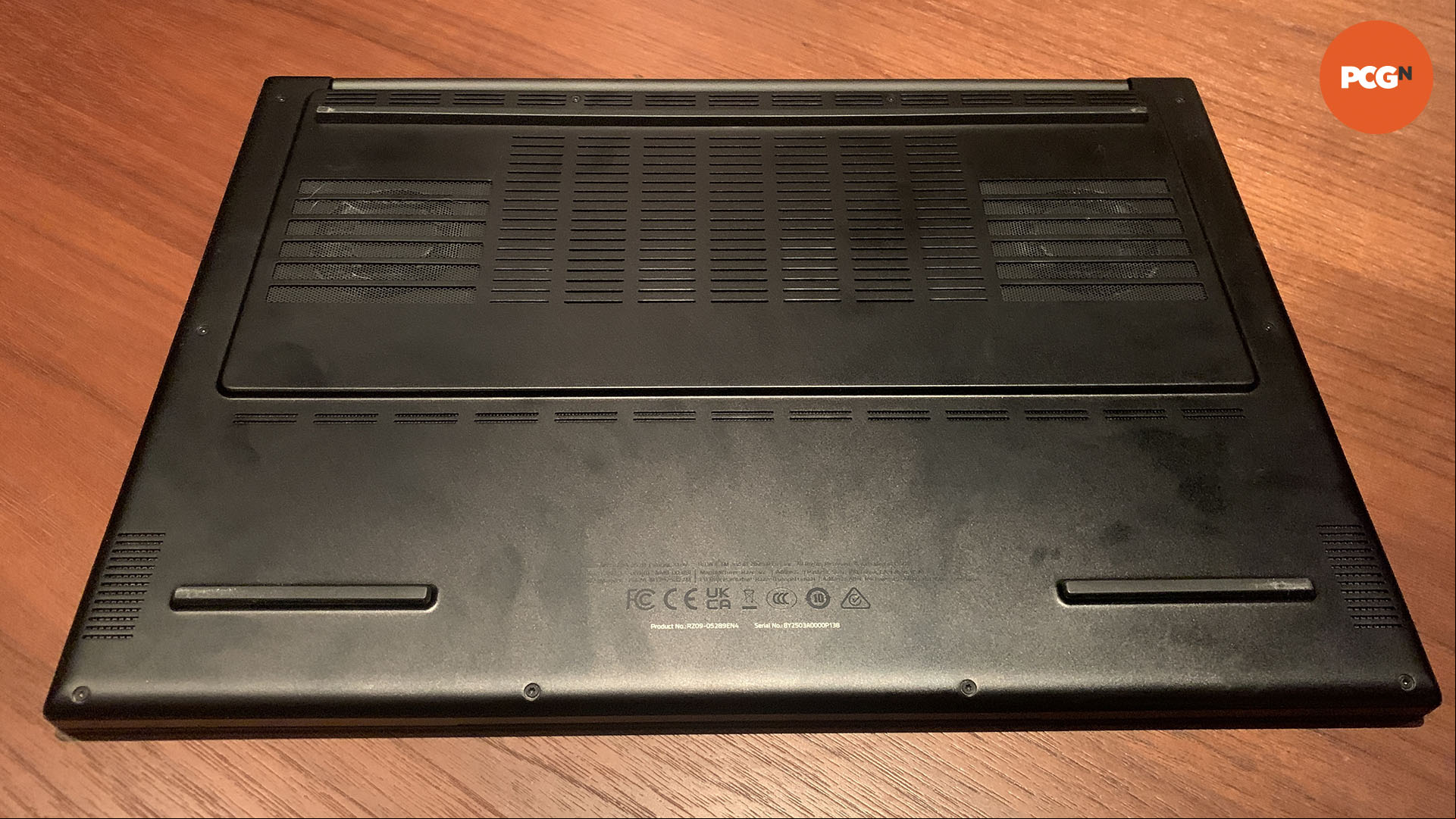 Razer Blade 16 2025 review: Bottom of gaming laptop showing vents.