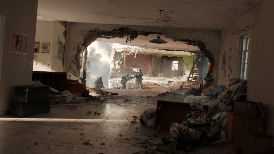 Battlefield 6 release date: a group of soldiers are pinned down by gunfire. One soldier takes cover behind a half-destroyed wall.